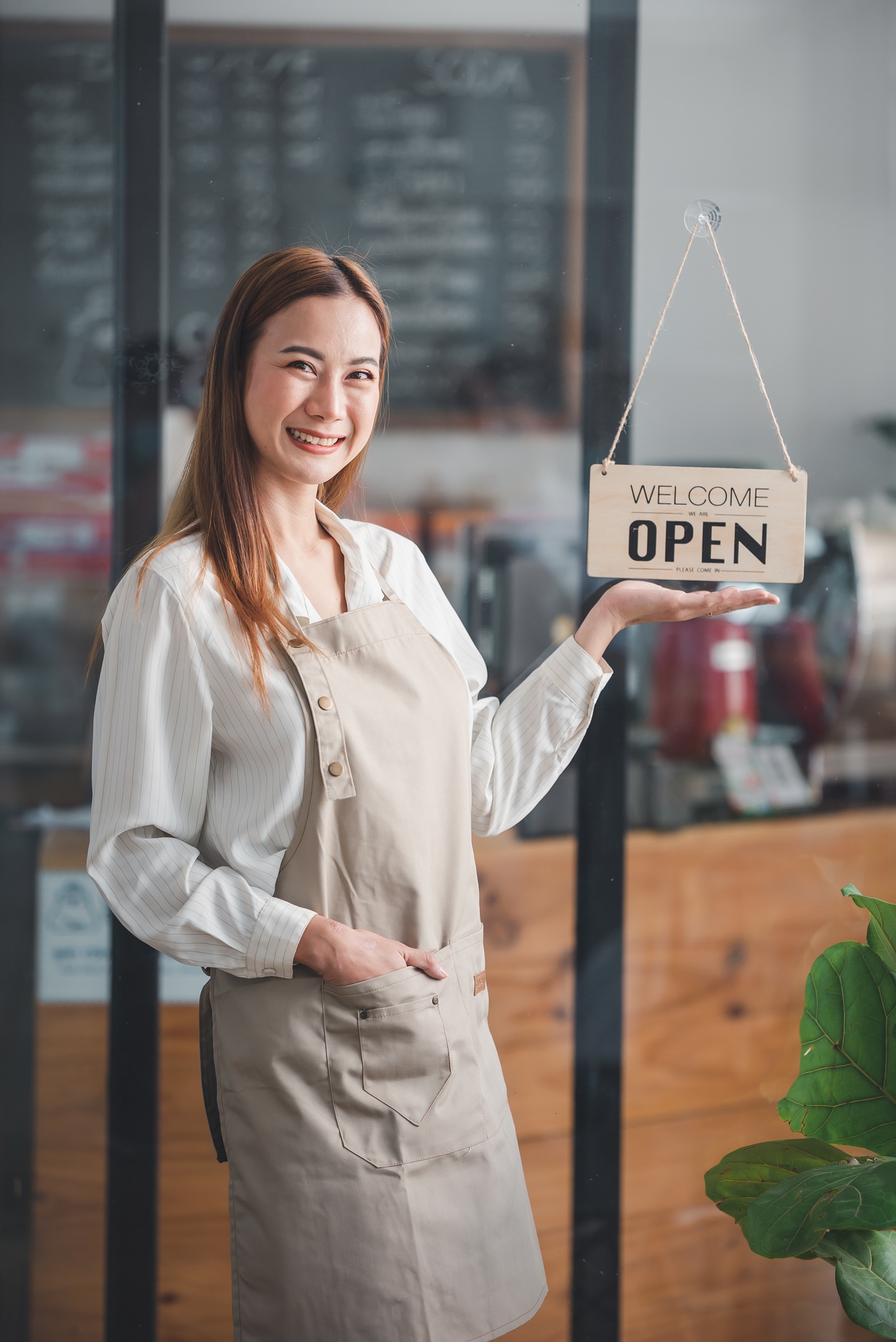 The shop owner turned the open sign. ready to serve